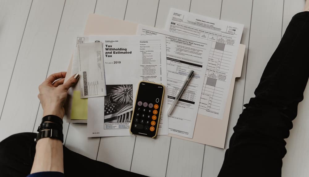 Signing paperwork at a desk